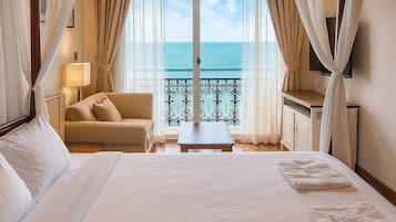 Deluxe Room, Sea View | Minibar, in-room safe, desk, blackout drapes