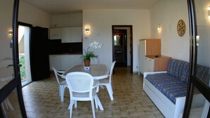 Apartment, 2 Bedrooms, Patio, Sea View | Living area - Porto Quadro (Santa Teresa di Gallura)