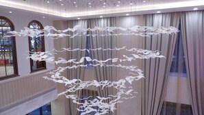 A modern interior with a unique hanging sculpture. - Hongluyuan Hotel (Shanghai)
