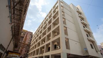 Stylish building with a grid-like facade and numerous windows.