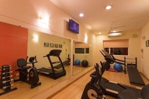 Stay fit and active in this well-equipped gym with treadmills, stationary bikes, and free weights.