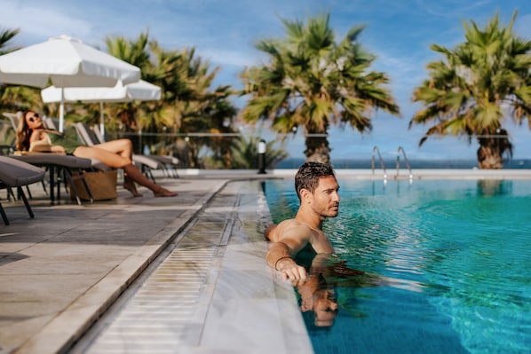 Indoor pool, 2 outdoor pools, open 10:00 AM to 6:30 PM, pool umbrellas