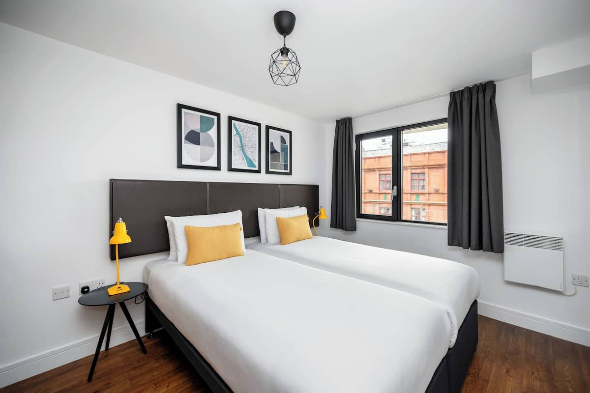 Premium bedding, pillow-top beds, desk, blackout curtains