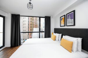 City Penthouse | Premium bedding, pillow-top beds, desk, blackout curtains