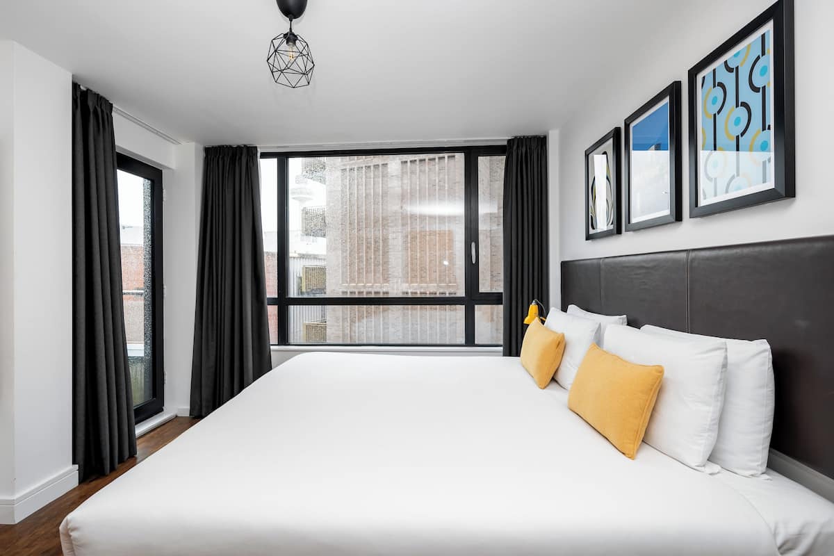 City Apartment | Premium bedding, pillow-top beds, desk, blackout curtains
