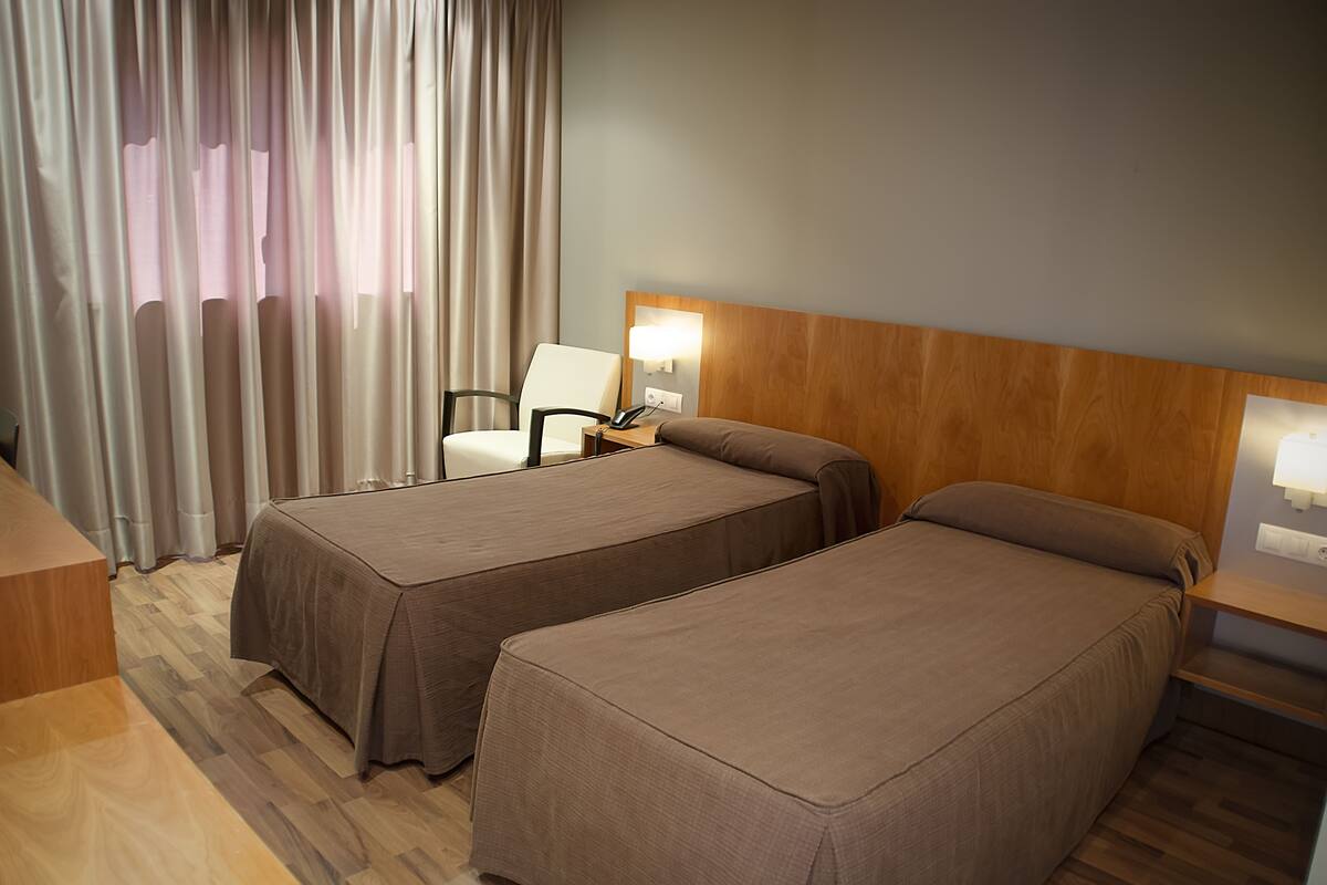 Premium bedding, desk, blackout drapes, soundproofing