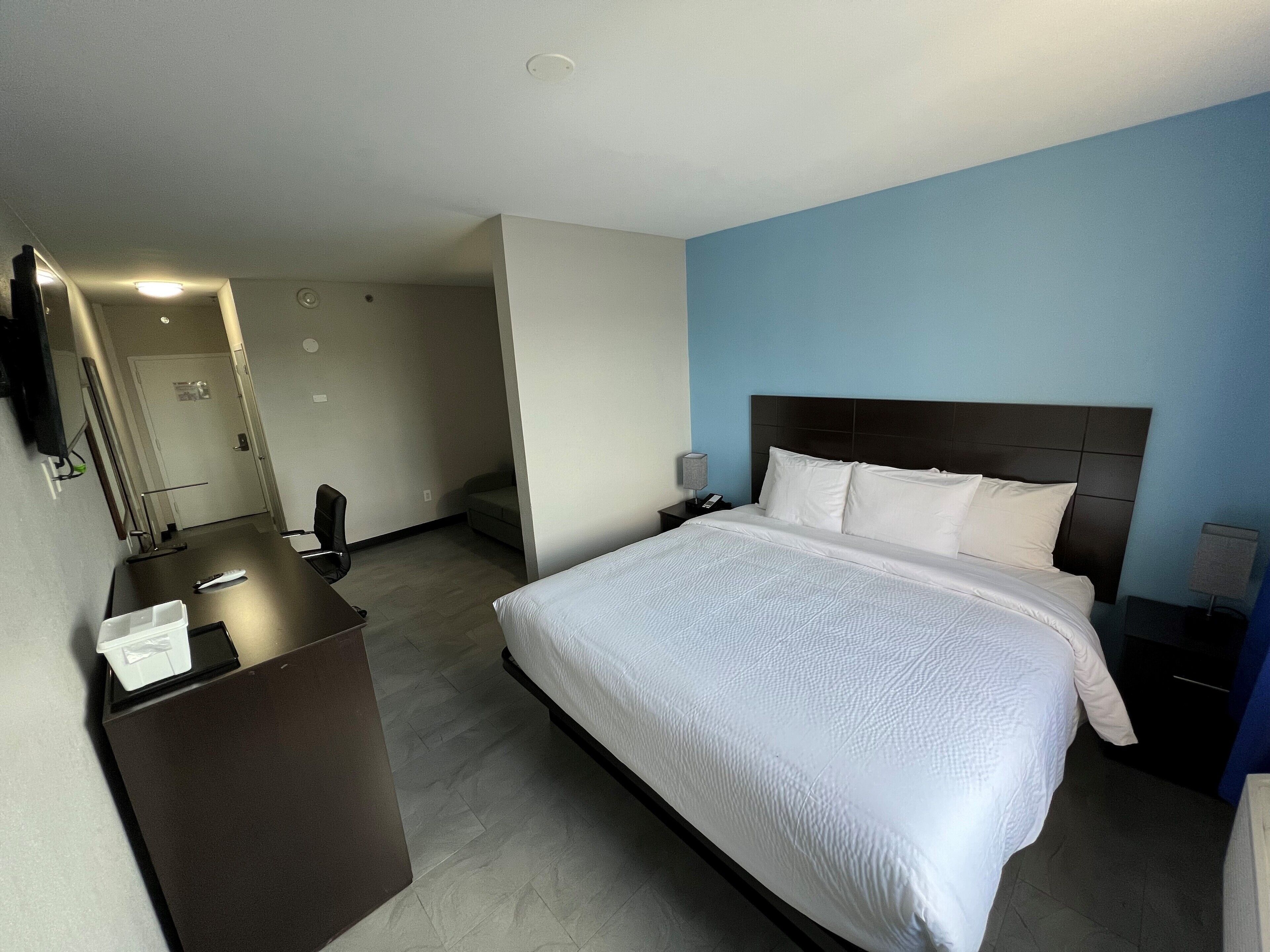 deluxe room, 1 king bed, non smoking | desk, free cots/infant beds