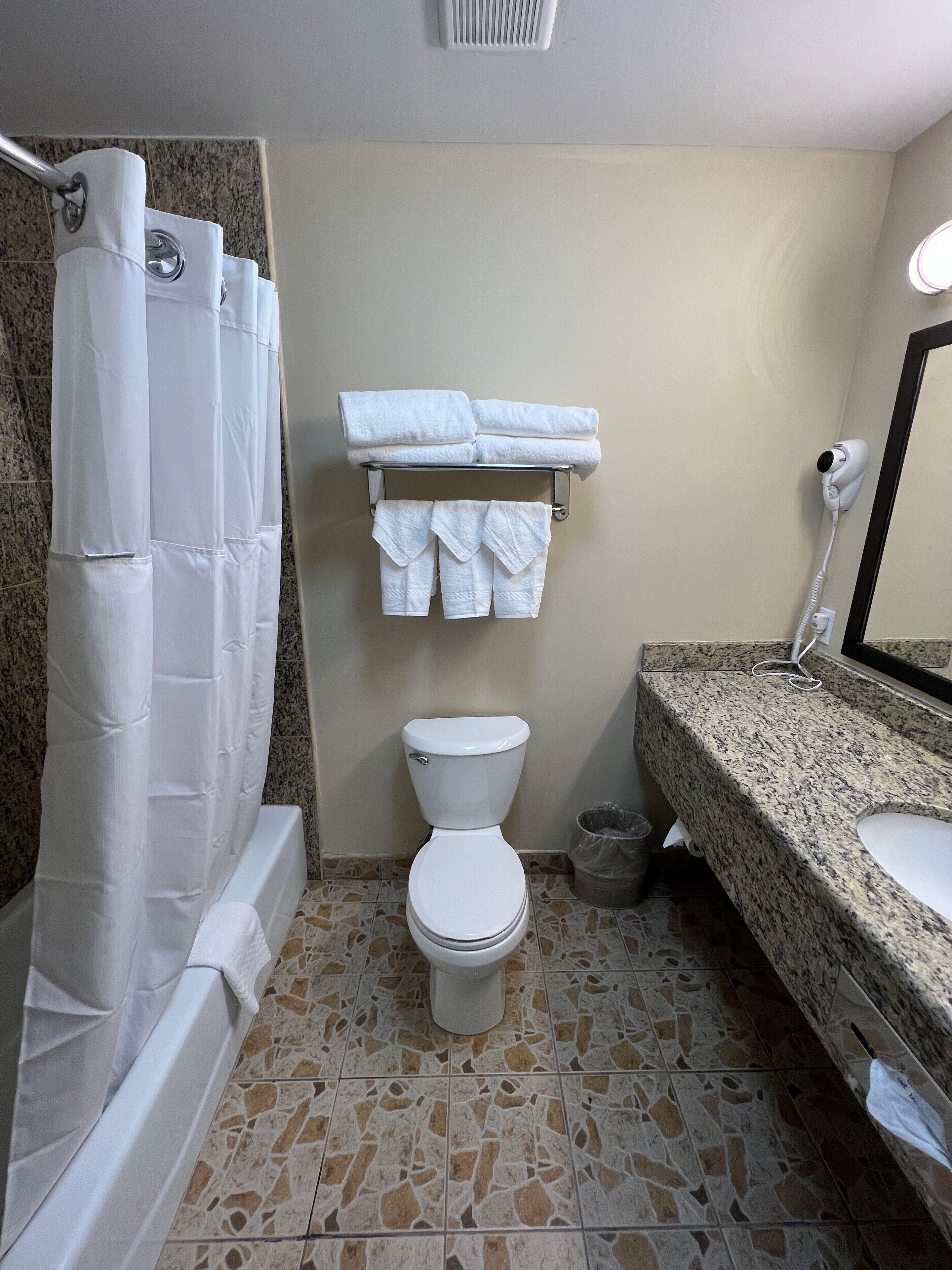 deluxe room, 2 double beds, non smoking | bathroom | combined shower/bathtub, hair dryer, towels
