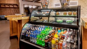 A beverage dispenser with various drinks and a menu board above it. - Hyatt Place Salt Lake City Airport (Salt Lake City)