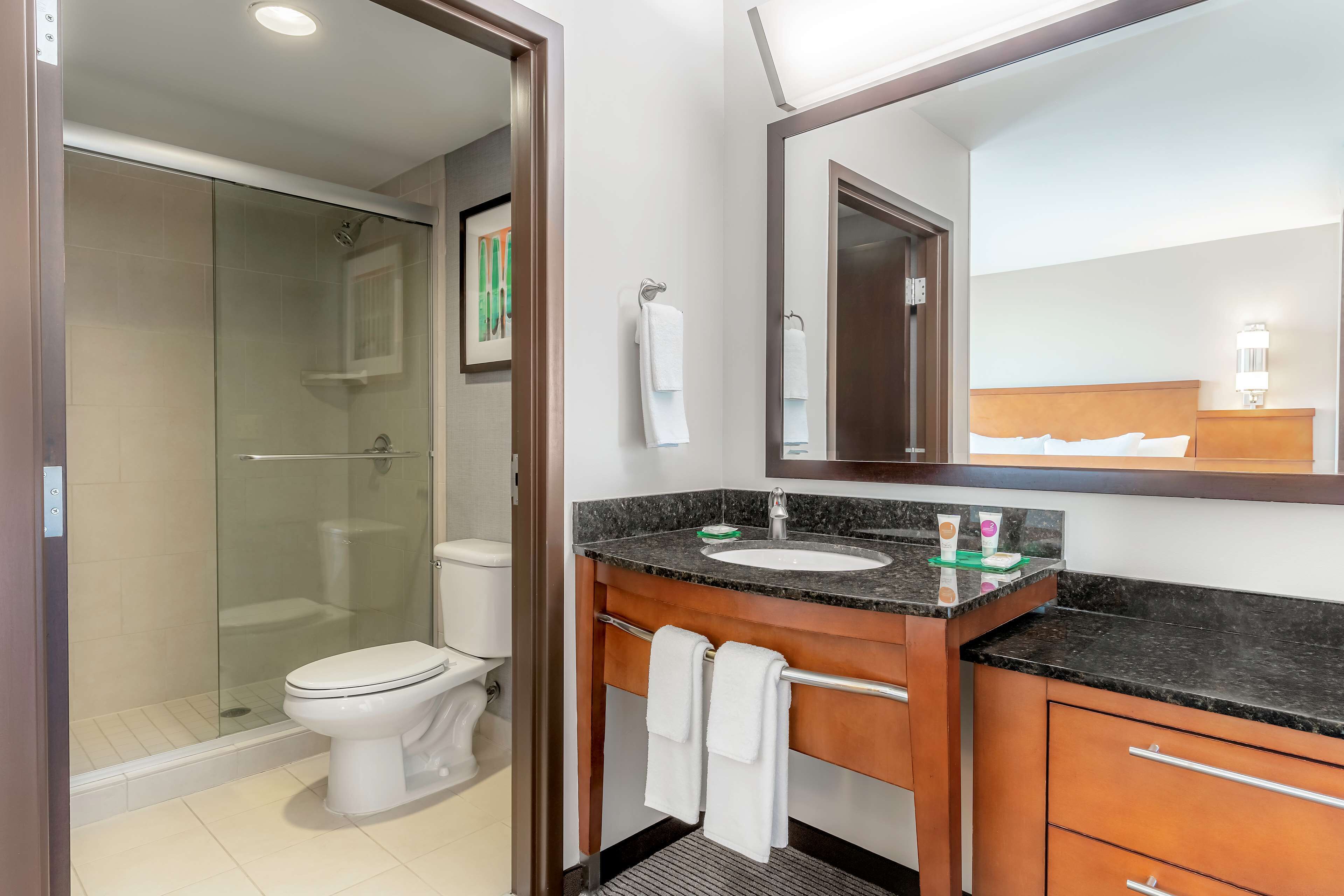 designer toiletries, hair dryer, towels