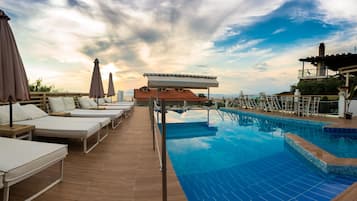 Seasonal outdoor pool, open 10:00 AM to 7:30 PM, pool umbrellas