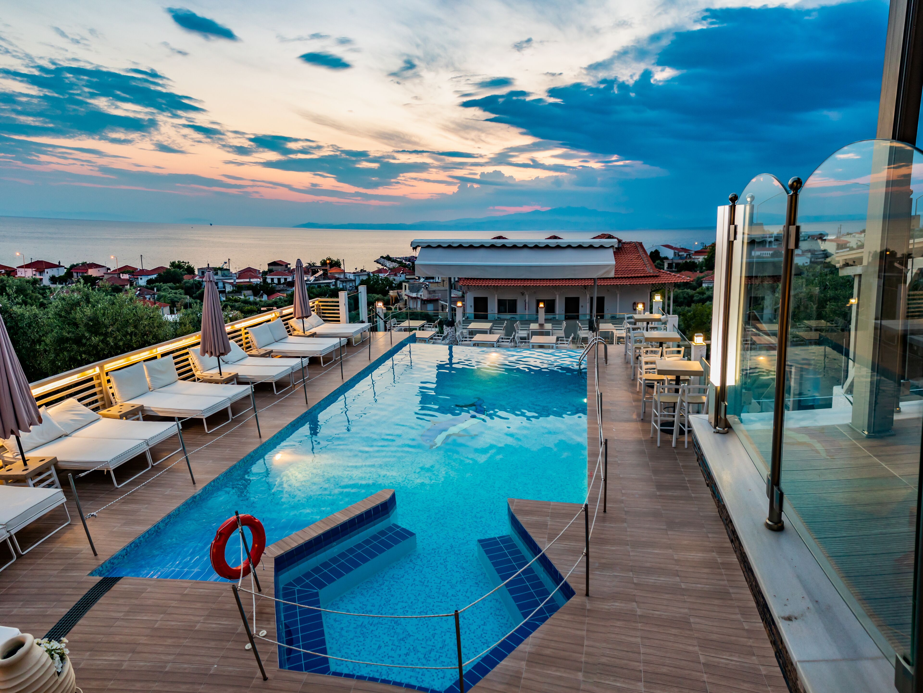 Seasonal outdoor pool, open 10:00 AM to 7:30 PM, pool umbrellas