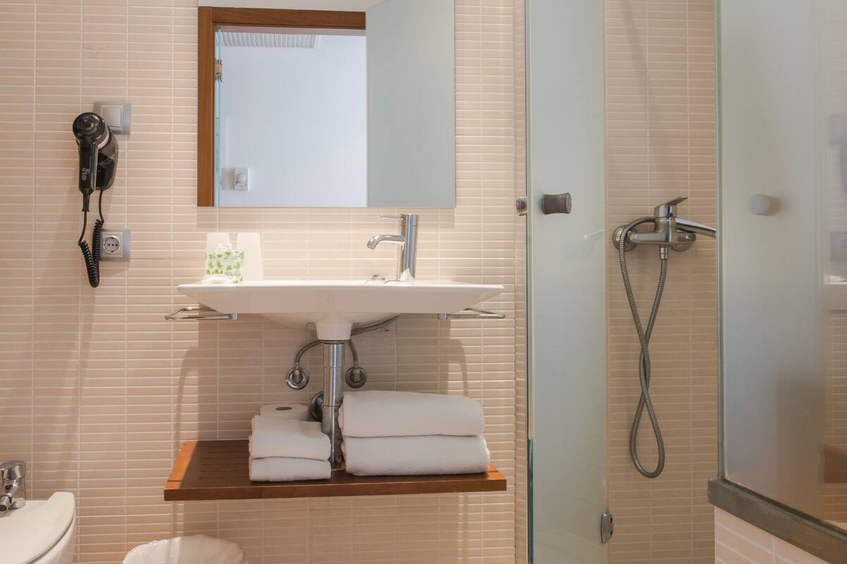 superior double room | bathroom | free toiletries, hair dryer, towels