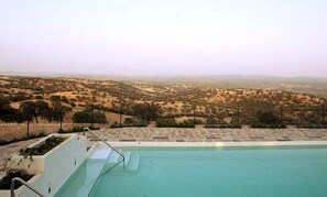 Seasonal outdoor pool, pool umbrellas, pool loungers