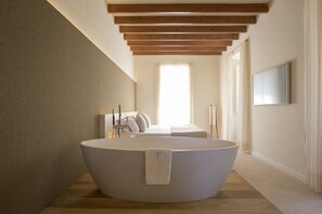Luxury Suite, Hot Tub | Minibar, in-room safe, individually decorated, individually furnished