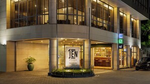 A modern hotel with a large entrance, a visible sign for 'JEN by Shangri-La Maldives Male', and a well-lit interior. - JEN Maldives Male by Shangri-La (Malé)