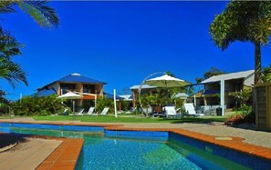 4 outdoor pools, a heated pool, pool loungers