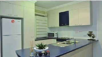 Fridge, microwave, electric kettle, toaster