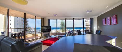 Two Bedroom Deluxe | Living area | Flat-screen TV