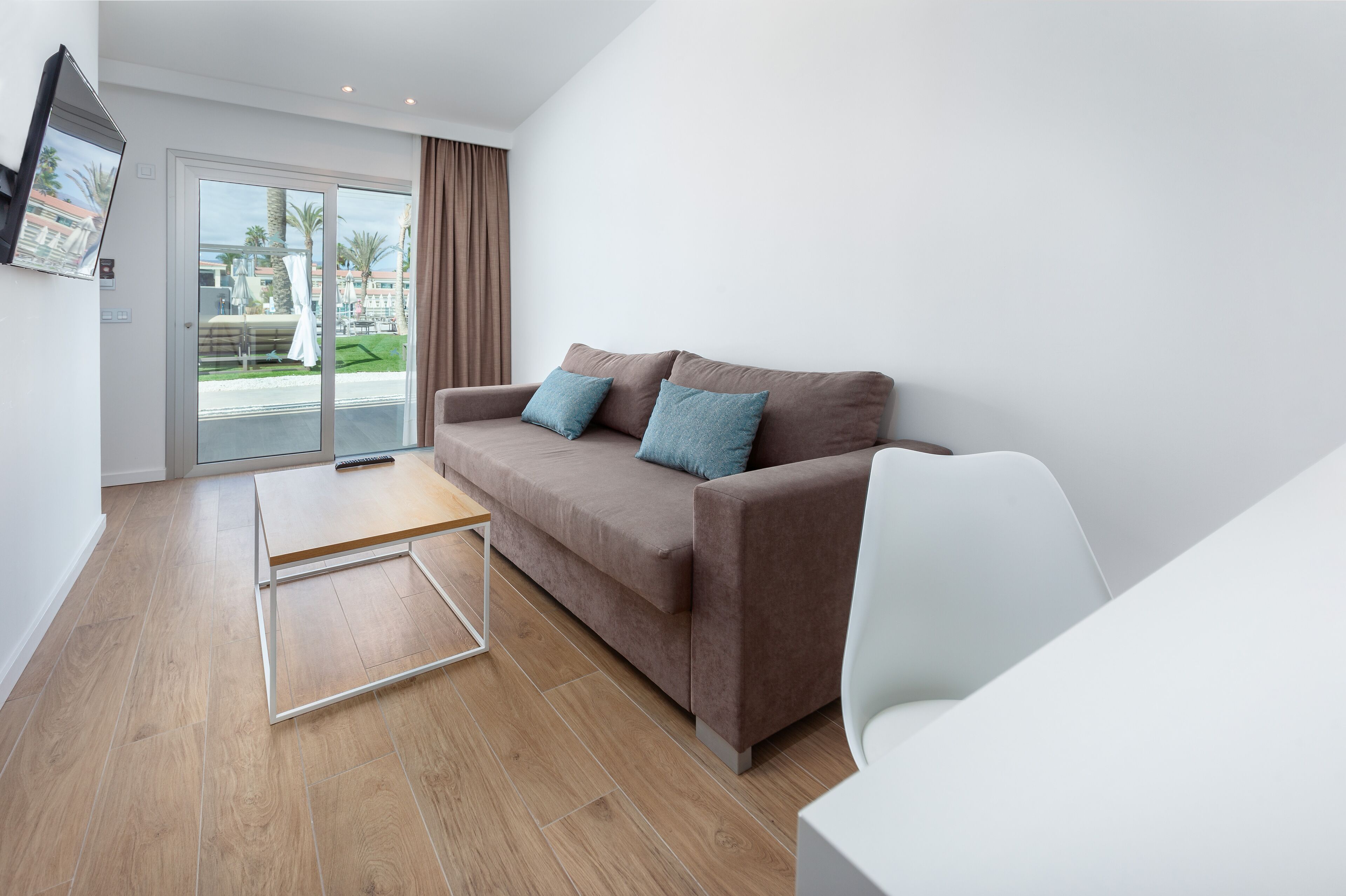 family double room, terrace, pool view | living room | 42-inch tv with satellite channels