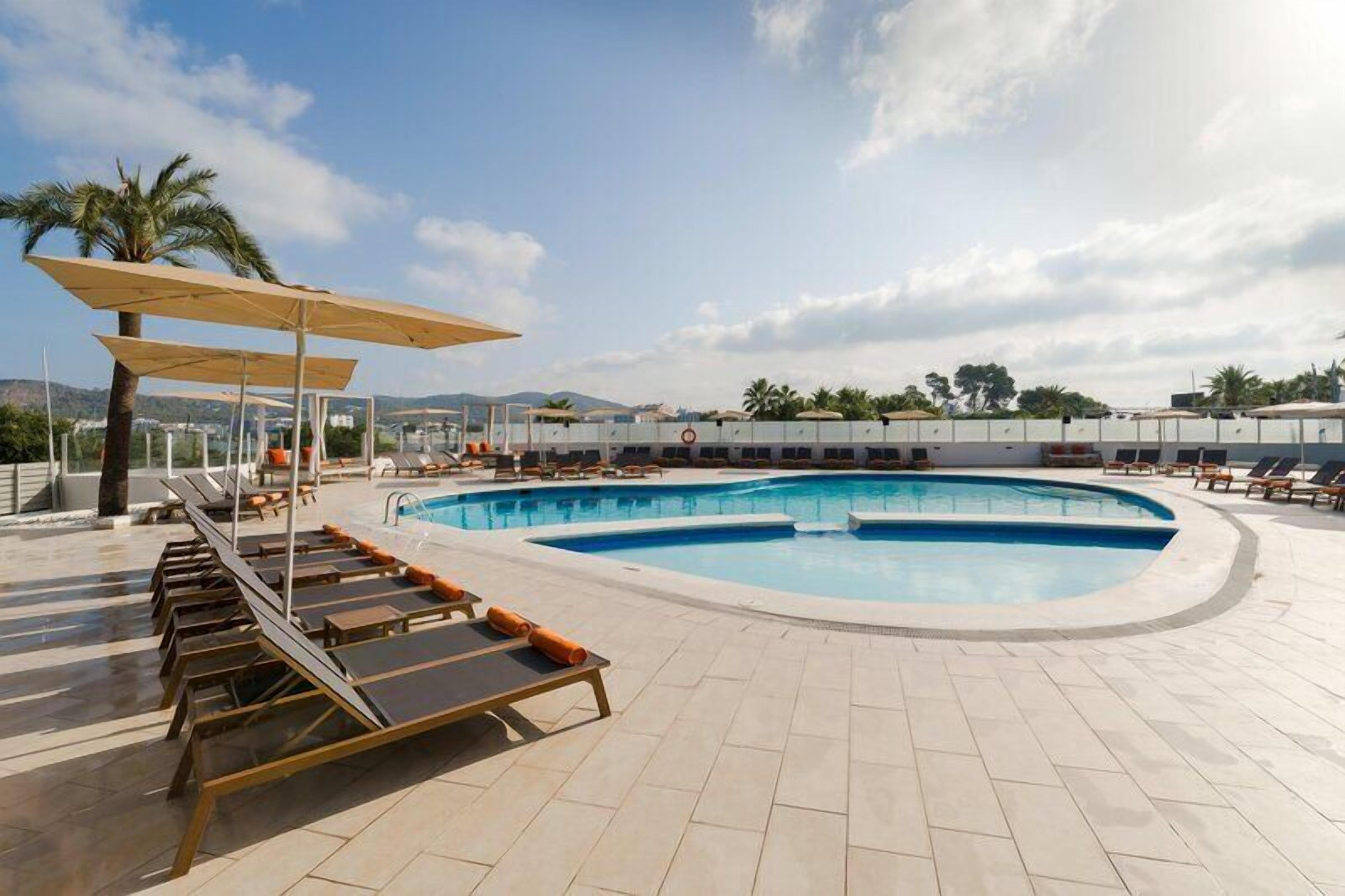 Outdoor pool, pool umbrellas, pool loungers