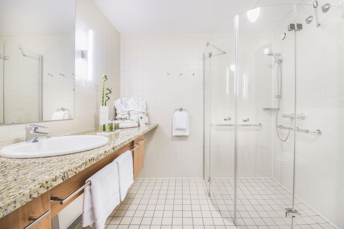 shower, designer toiletries, hair dryer, towels