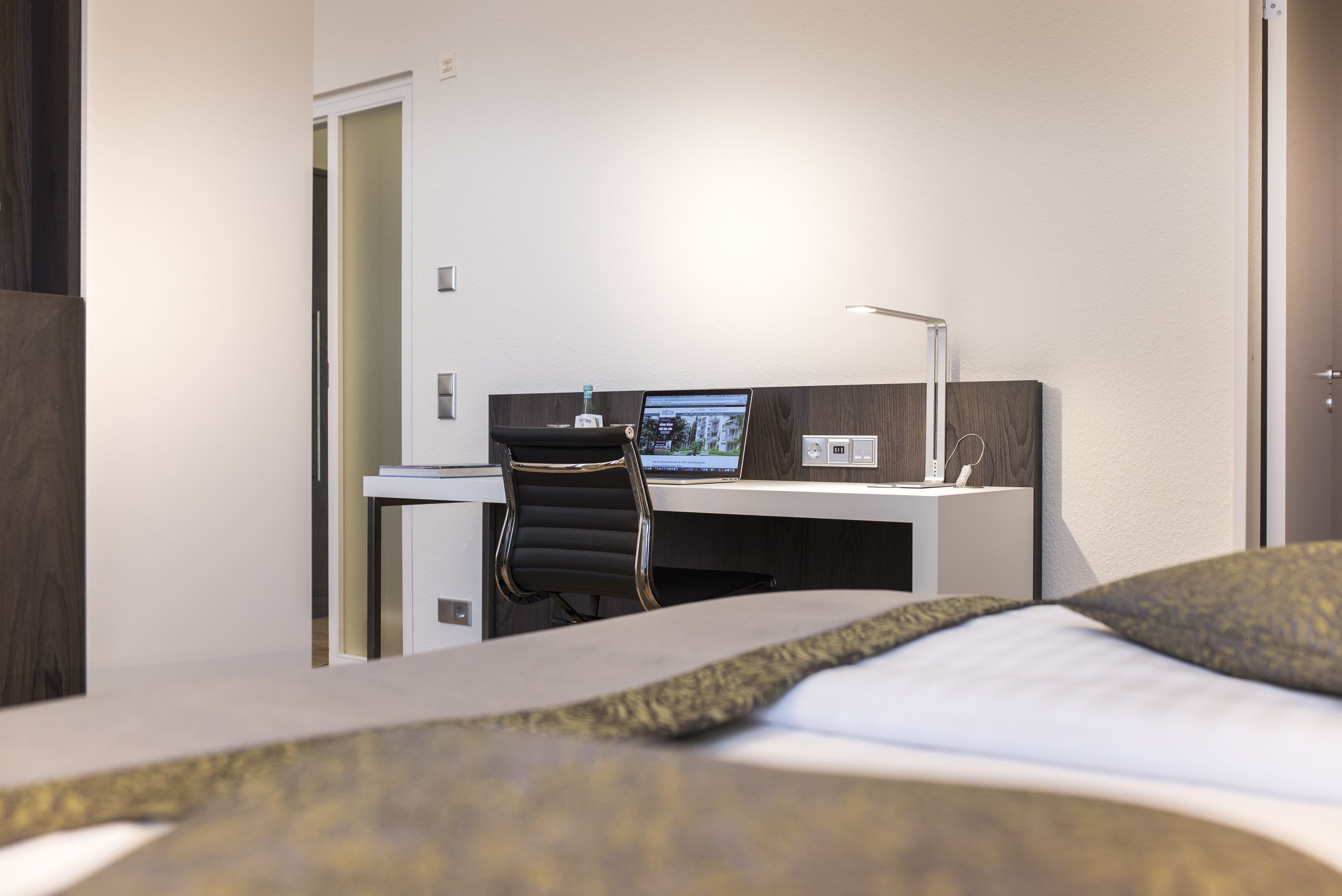 deluxe room | living area | lcd tv, first-run films, heated floors