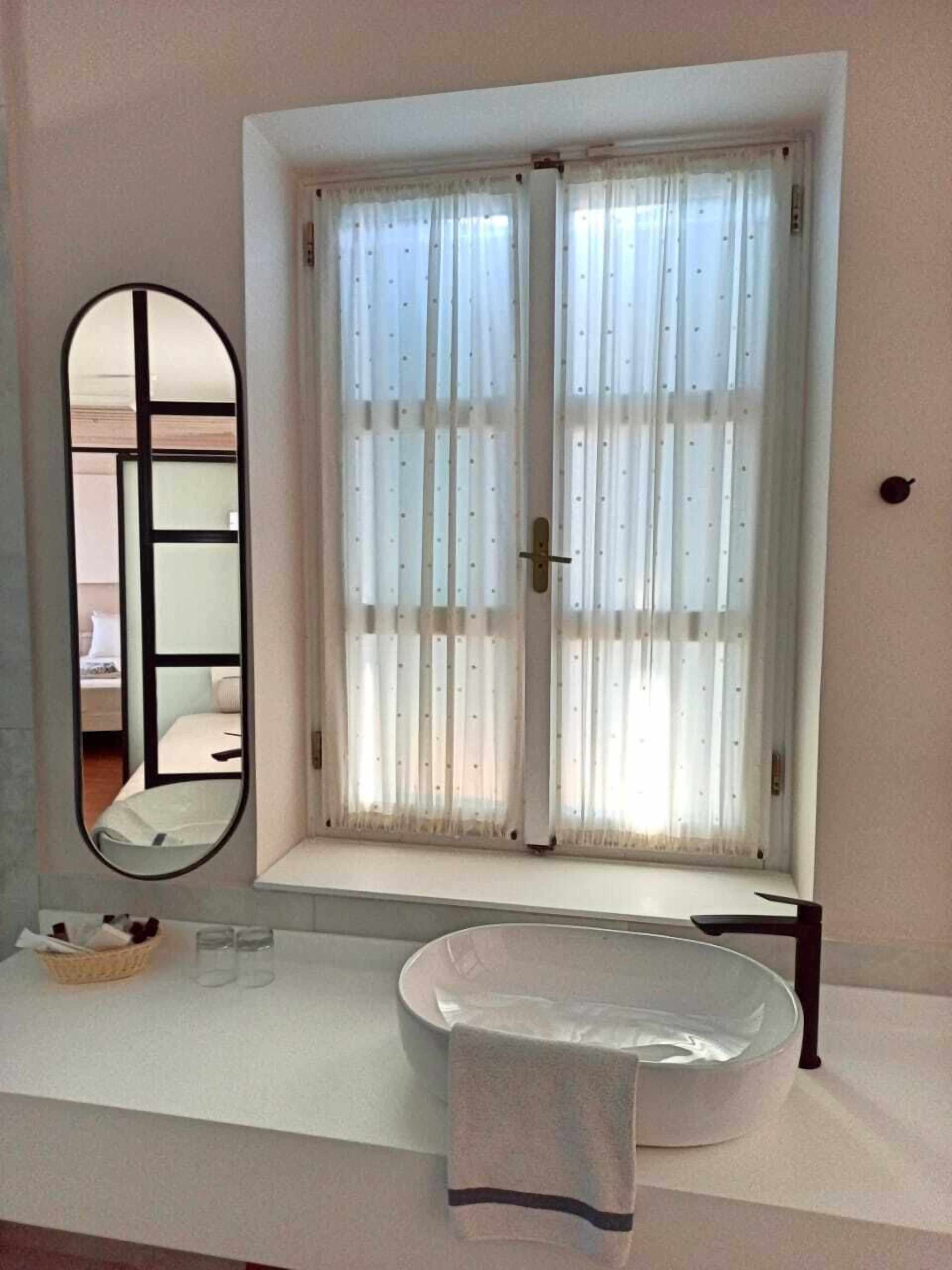 superior twin room, sea view | bathroom | hair dryer, towels