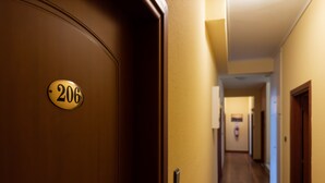 A hallway with a door labeled '206'. - Anemoni (Piraeus)