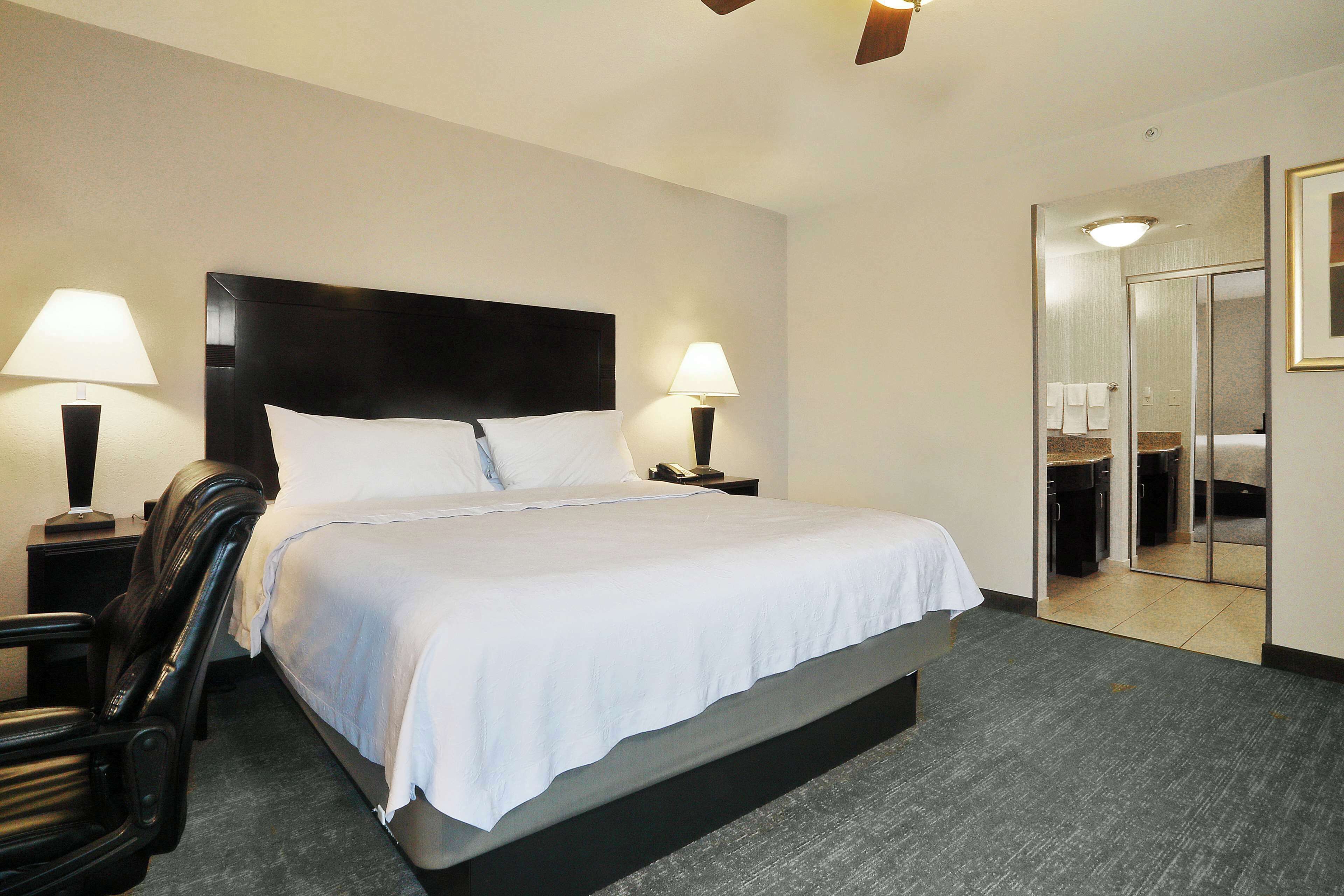 hypo-allergenic bedding, laptop workspace, blackout curtains