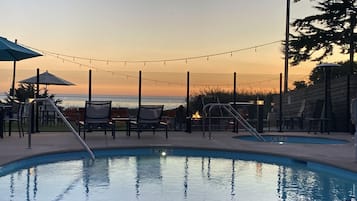 Outdoor pool, open 9:00 AM to 9:00 PM, pool umbrellas