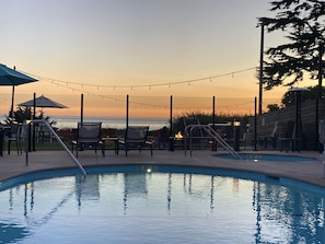 Outdoor pool, open 9:00 AM to 9:00 PM, pool umbrellas