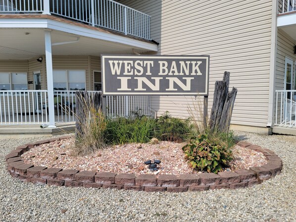 A sign for West Bank Inn. - West Bank Inn (Celina)