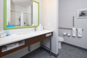 A modern bathroom with a large mirror, white sink, and a toilet. - Hampton Inn & Suites Tucson East/Williams Center (Tucson)