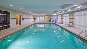 An indoor swimming pool with clear water, surrounded by lounge chairs and a tiled wall. - Hampton Inn Matamoras/Milford (Matamoras)