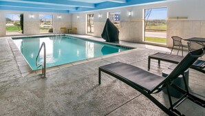 A swimming pool with a clear view of the outdoors, a covered area, and lounge chairs. - Hampton Inn and Suites Fort Worth/Forest Hill (Fort Worth)