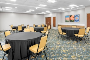 A conference room with multiple tables and chairs, a tiled floor, and artwork on the walls. - Hampton Inn and Suites Fort Worth/Forest Hill (Fort Worth)