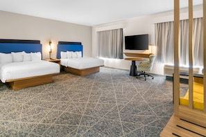 A hotel room with two beds, a desk, a chair, a TV, and a large window with curtains. - Hampton Inn and Suites Fort Worth/Forest Hill (Fort Worth)
