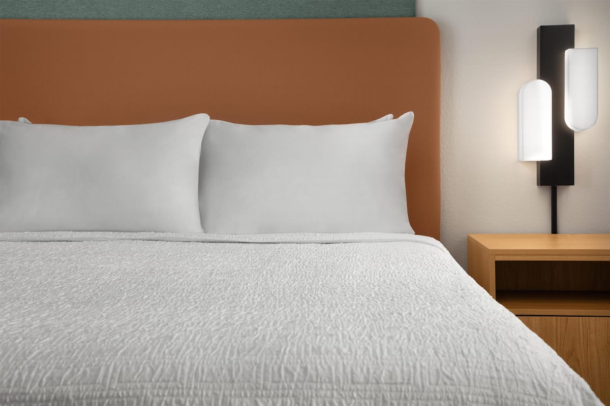 Premium bedding, blackout drapes, iron/ironing board