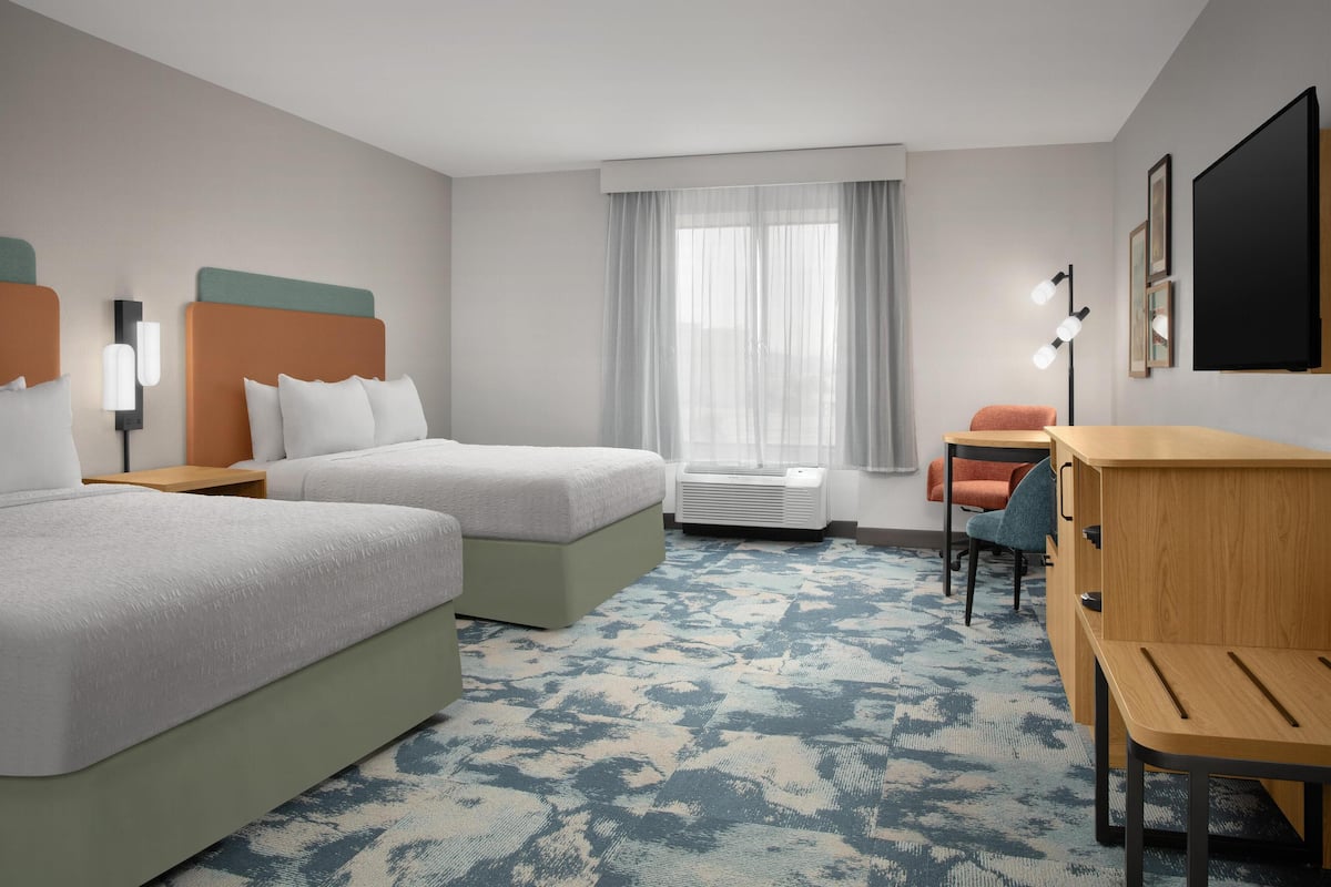 Premium bedding, blackout drapes, iron/ironing board