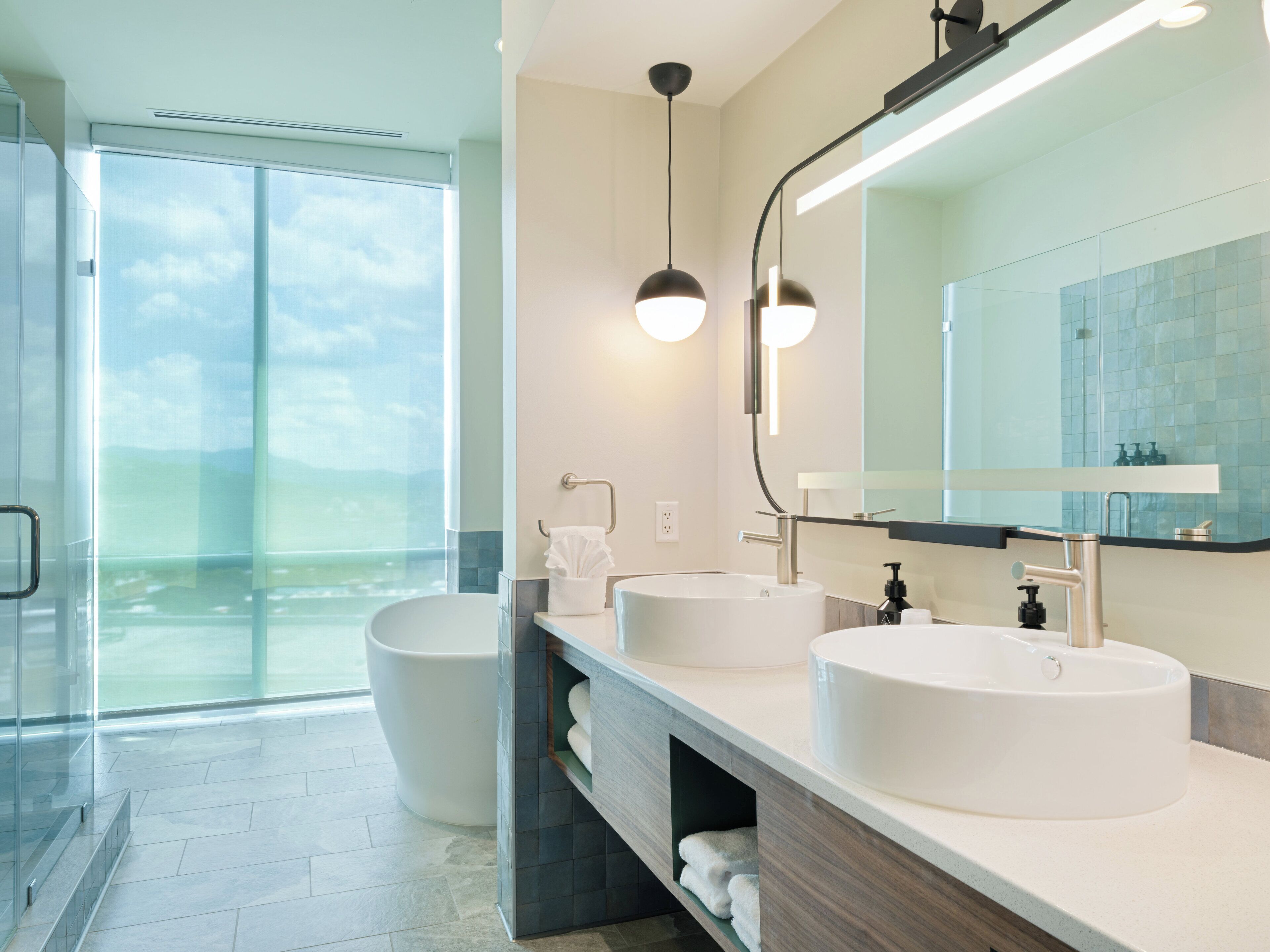 premium room, 2 queen beds (bath shower combination) | bathroom | free toiletries, hair dryer, towels