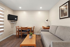 Room, 1 Bedroom, Kitchen | Living area | Flat-screen TV