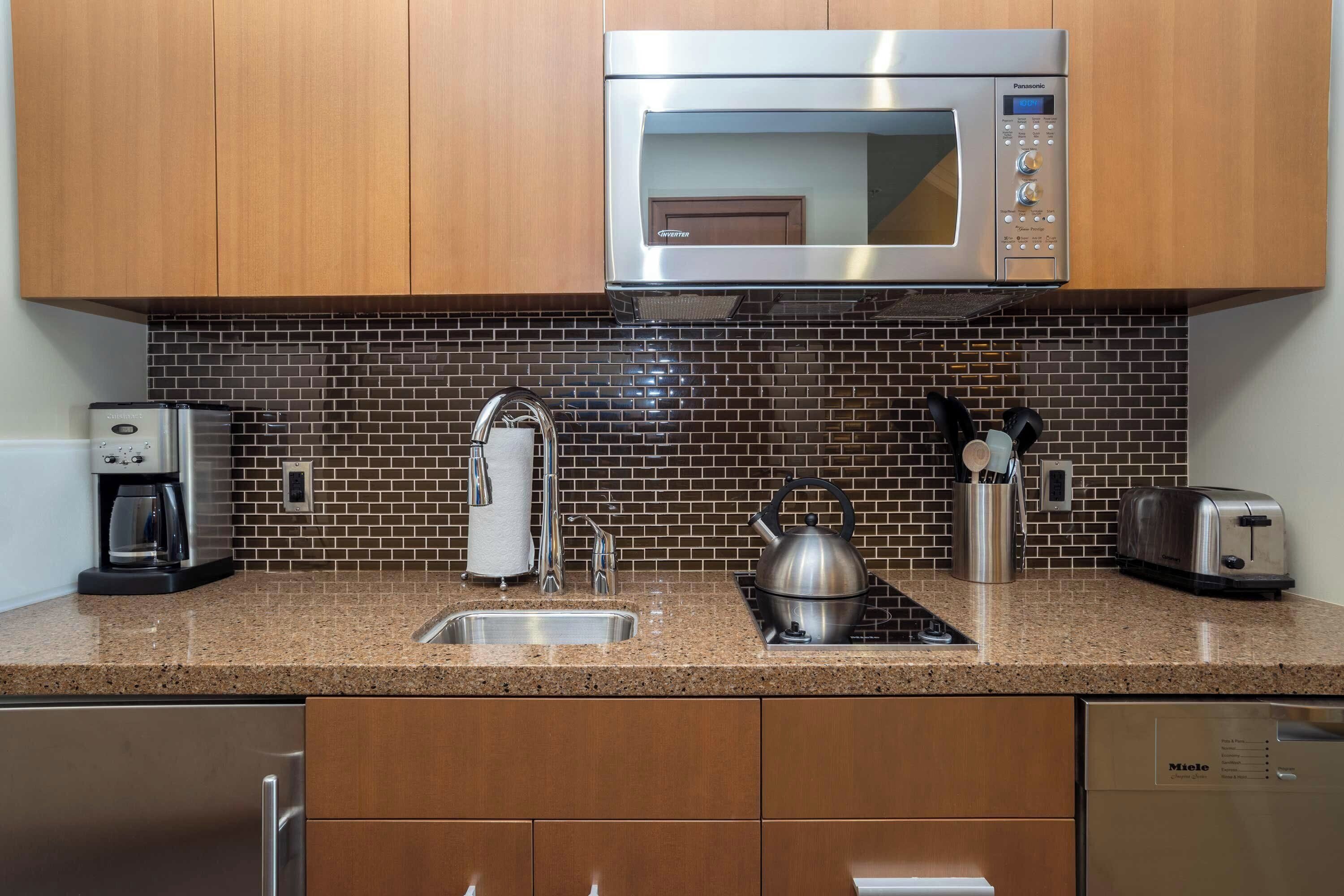 premium studio suite, 1 king bed with sofa bed | private kitchenette | fridge, microwave, stovetop, dishwasher