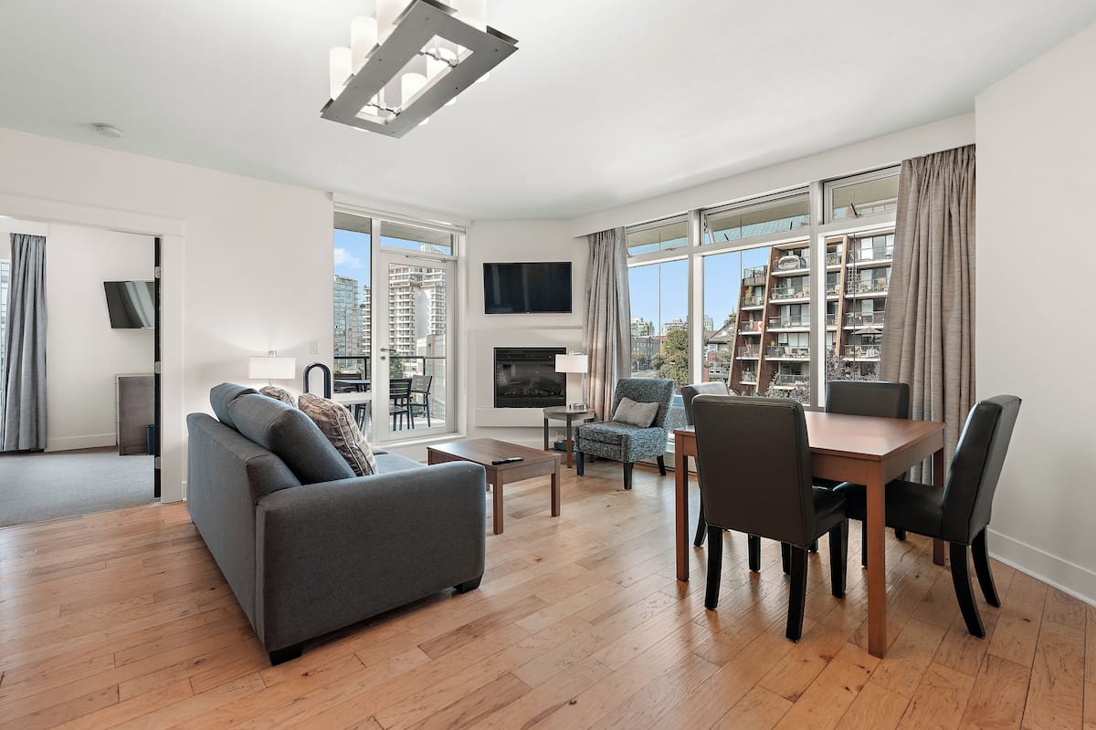 Deluxe Suite, 2 Bedrooms | Living area | 42-inch flat-screen TV with digital channels, TV, fireplace