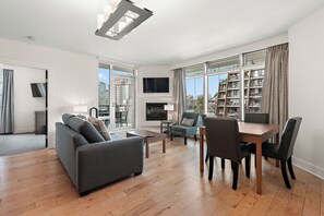 Deluxe Suite, 2 Bedrooms | Living area | 42-inch flat-screen TV with digital channels, TV, fireplace - The Parkside Hotel & Spa (Victoria)