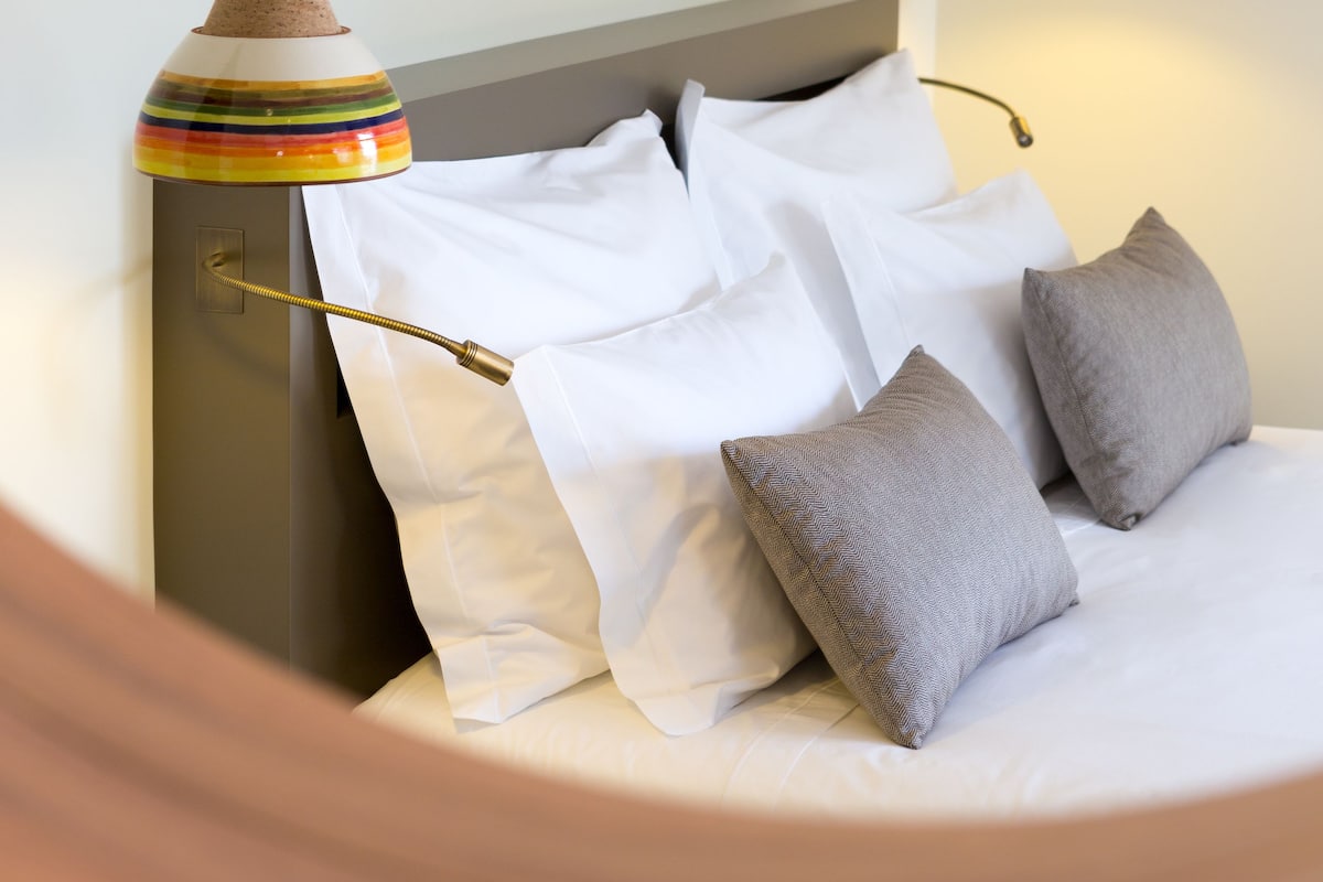 designer toiletries, hair dryer, towels