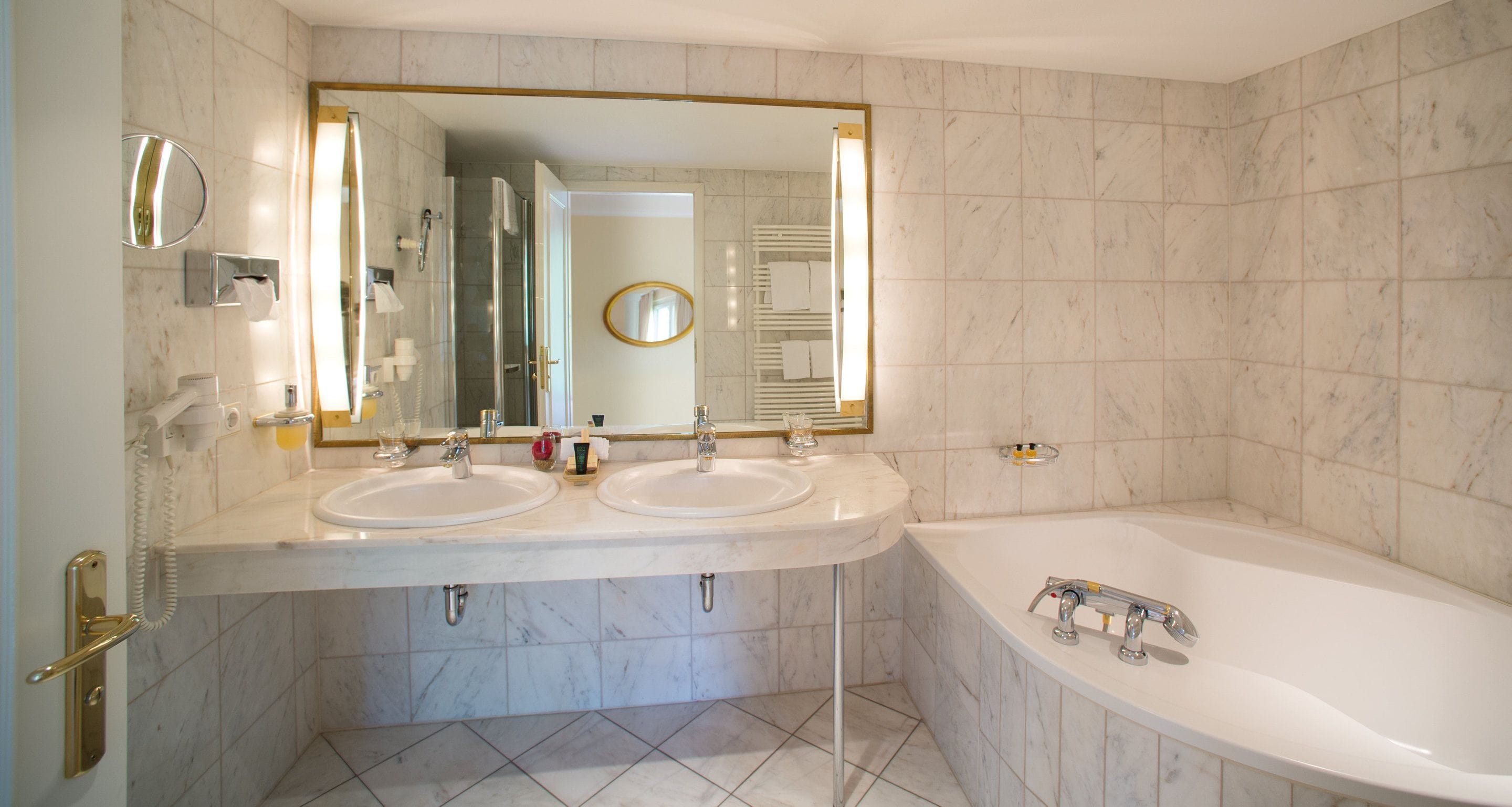 designer toiletries, hair dryer, bathrobes, slippers