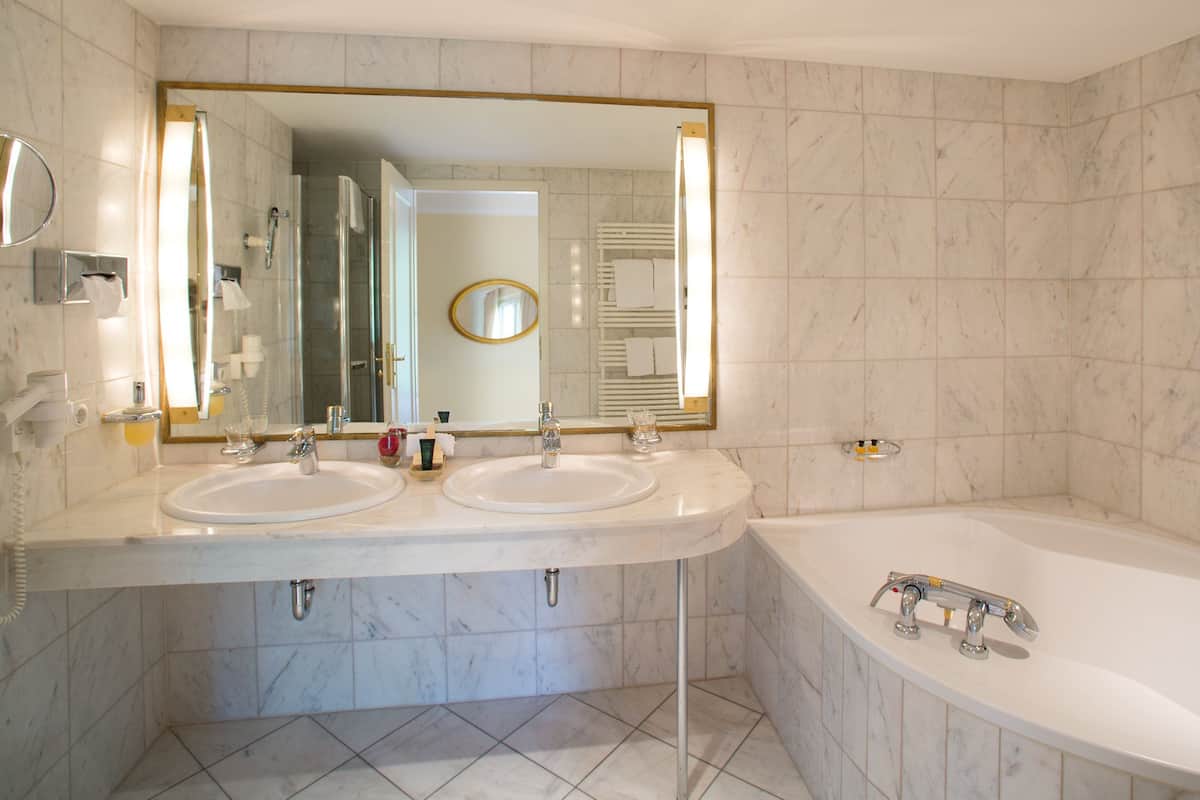 designer toiletries, hair dryer, bathrobes, slippers