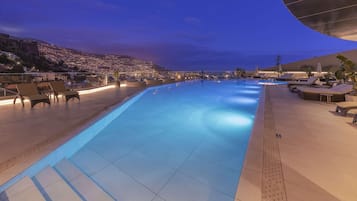 Indoor pool, outdoor pool, pool umbrellas, pool loungers