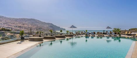 Indoor pool, outdoor pool, pool umbrellas, sun loungers